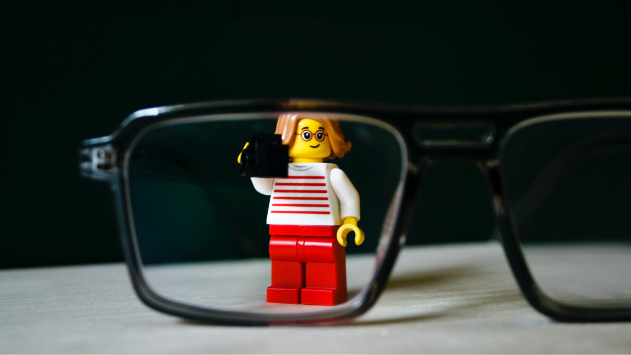 Lego figure looking through glasses