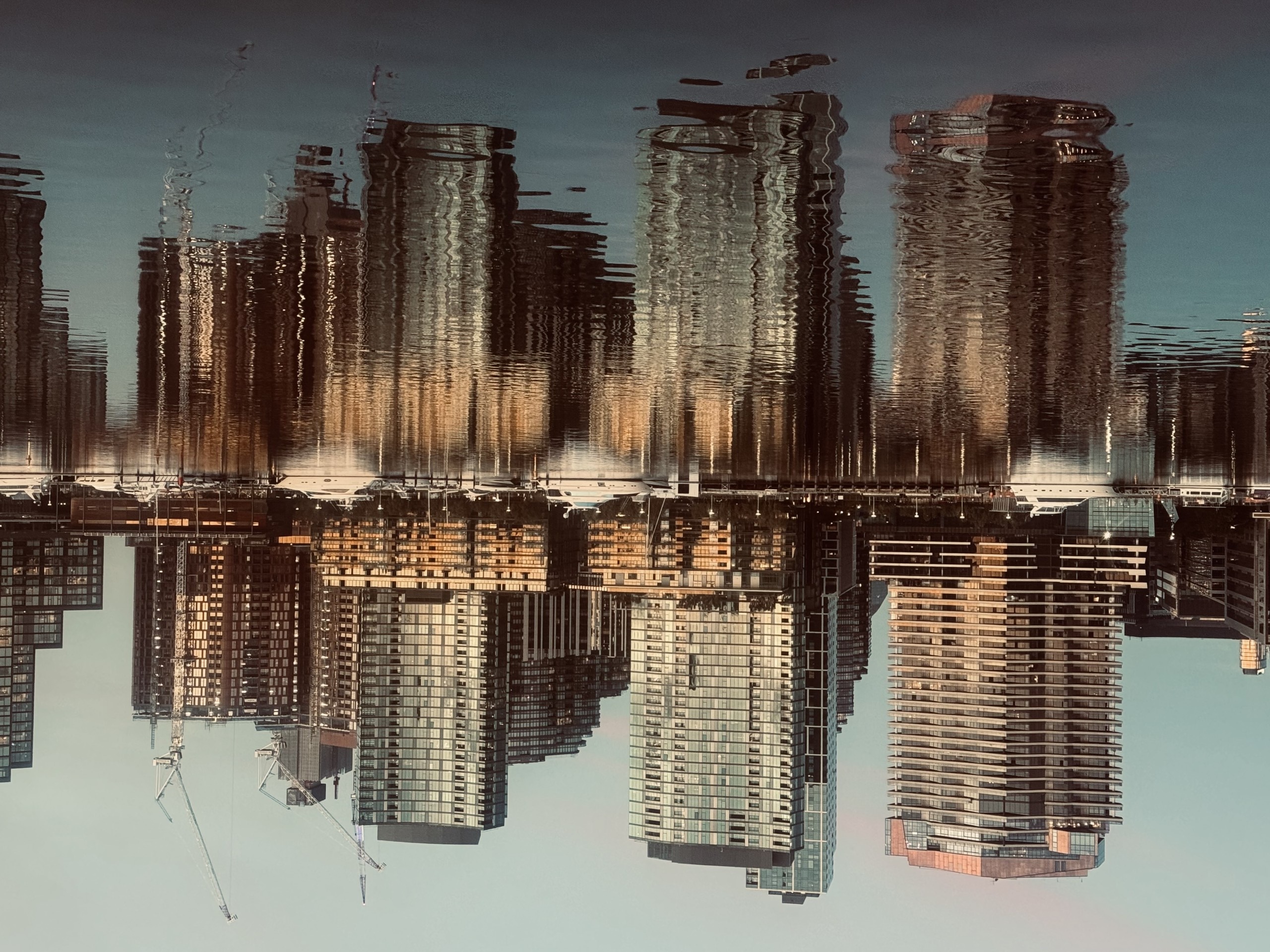 Melbourne city skyline reflected in the water of the river