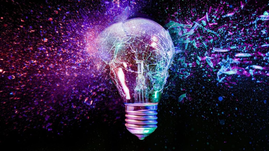 Lightbulb on purple and pink abstract background